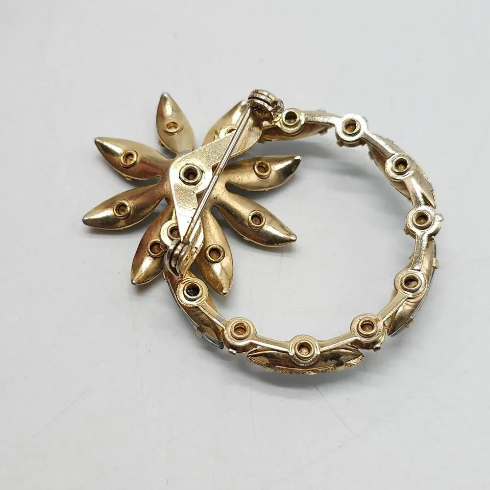 Vintage Gold Tone Brooch With Blue Rhinestones In Floral Design